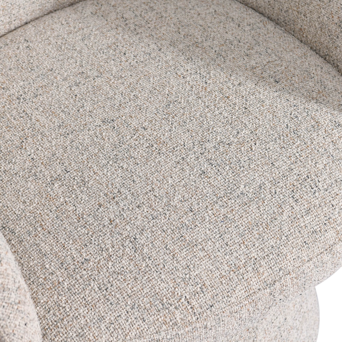 Close-up overhead view of the Misha Club Chair seat cushion showing the tightly woven, multi-tonal sand polyester fabric texture in detail