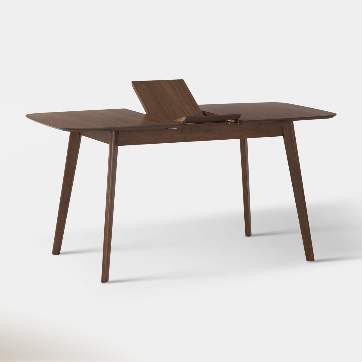 Close-up of the Arden table with butterfly leaf partially unfolded, showing the self-storing extension mechanism and walnut grain detail