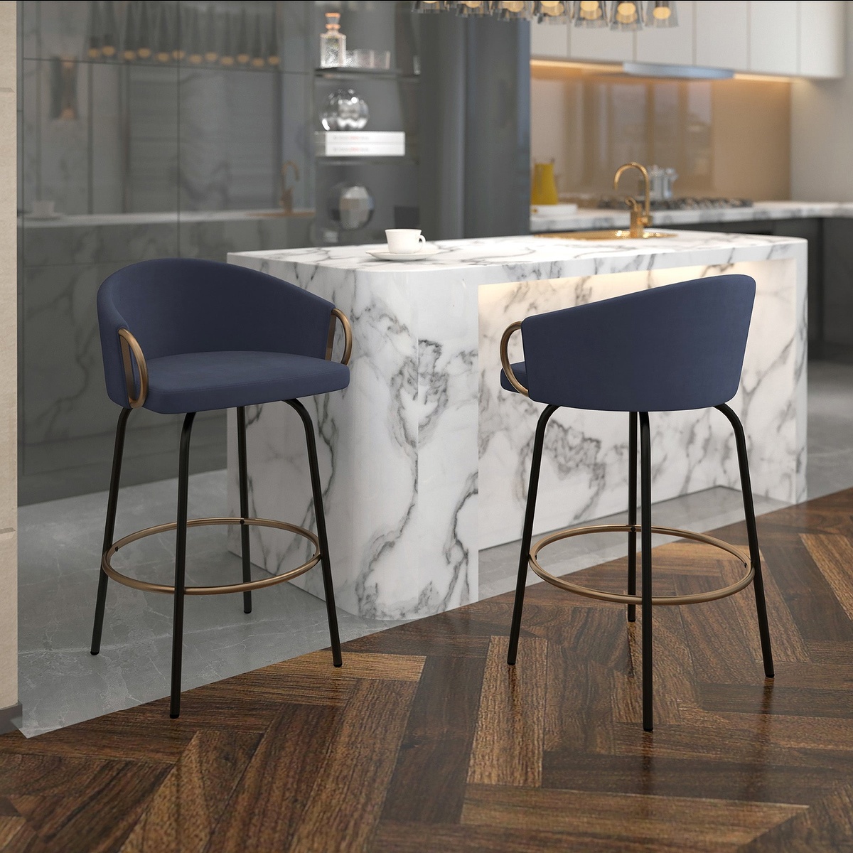 Lifestyle photo showing a pair of Lavo blue velvet counter stools positioned at a marble kitchen island in a modern upscale kitchen
