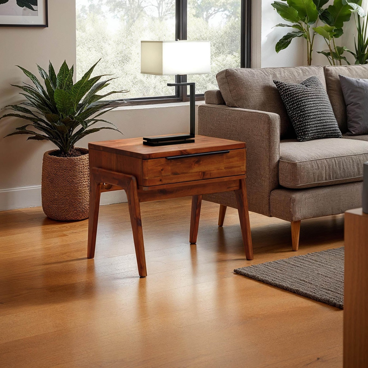 Remix Side Table styled in a bright living room beside a grey sofa, with a table lamp on top and indoor plants nearby