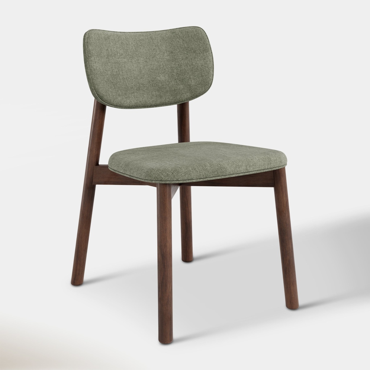 Front view of the Maia dining chair with fern green upholstered seat and back on walnut-toned wood legs