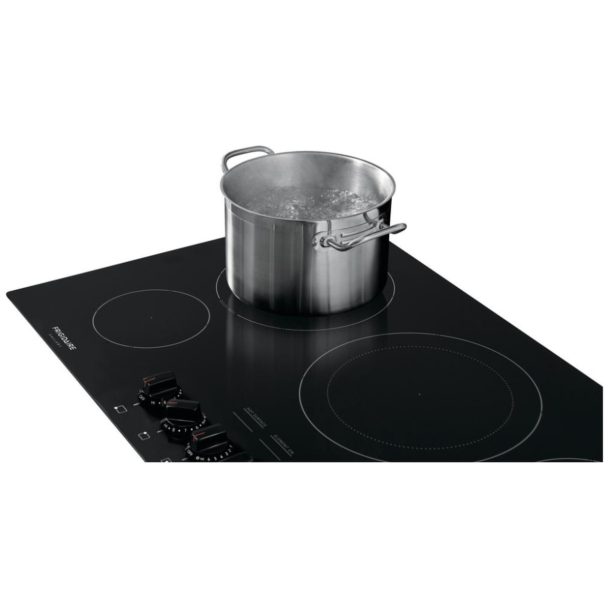 Stainless steel pot actively boiling water on the Frigidaire Gallery FGEC3648UB black ceramic glass cooktop, showcasing the Quick Boil element in use