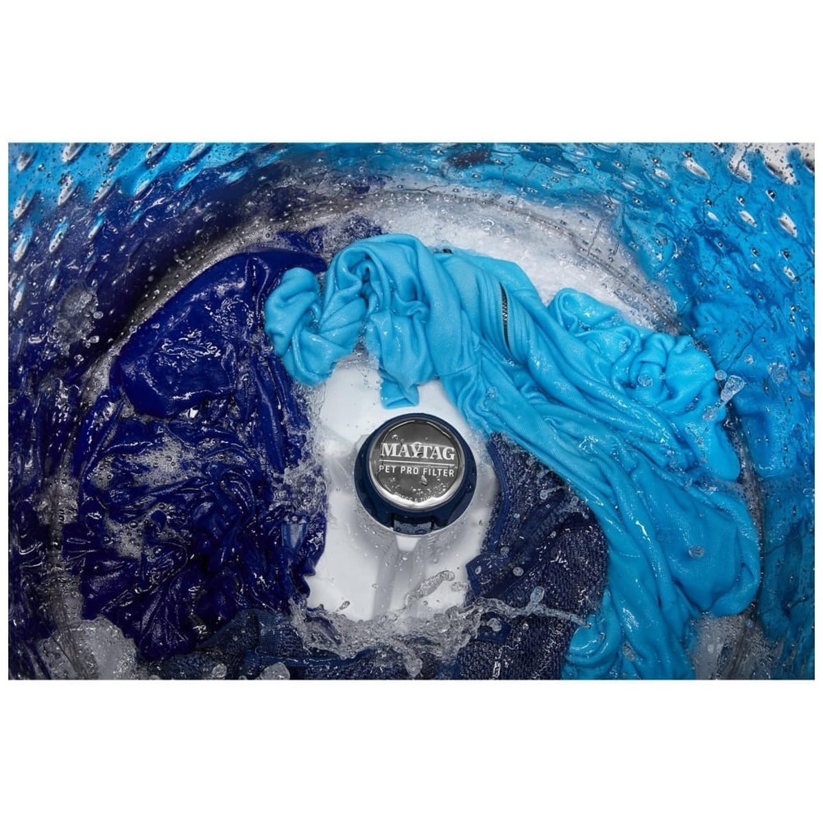 Interior drum shot of the Maytag MTW5600RW showing the Pet Pro Filter impeller in action with clothes swirling in soapy water