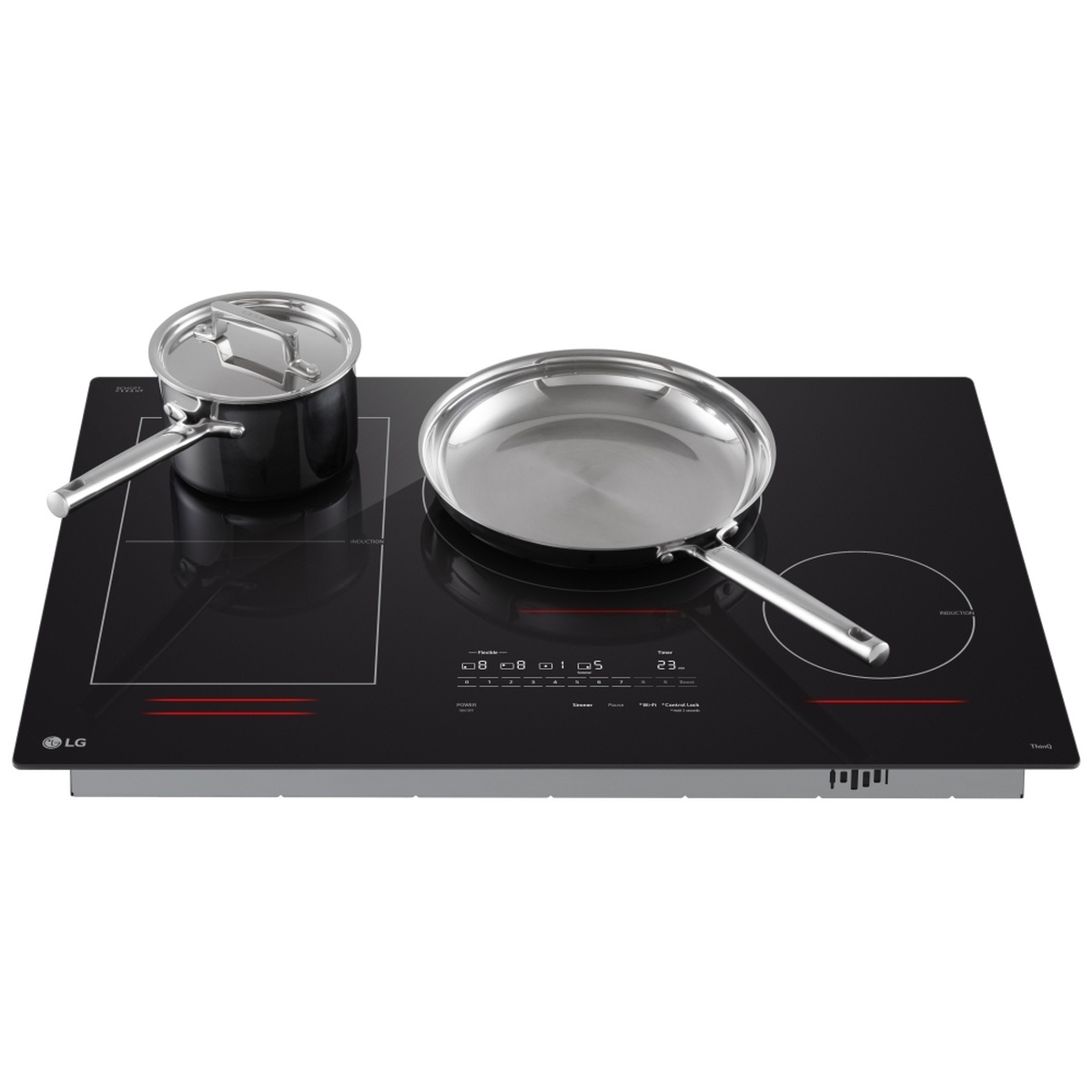 Angled lifestyle view of LG CBIH3017BE induction cooktop with a stainless steel saucepan and frying pan placed on the cooking zones