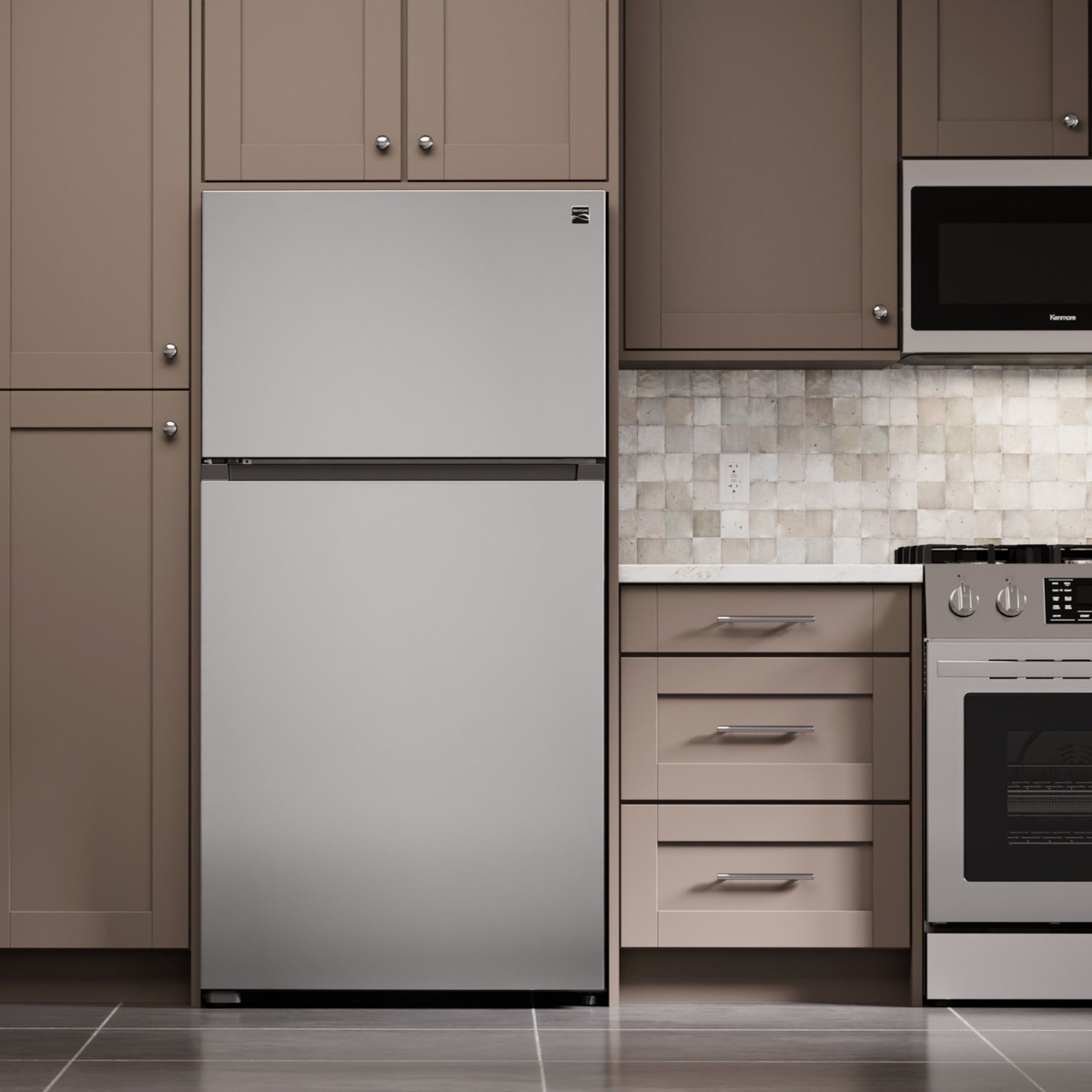 Stainless-look top-freezer refrigerator installed in a modern kitchen