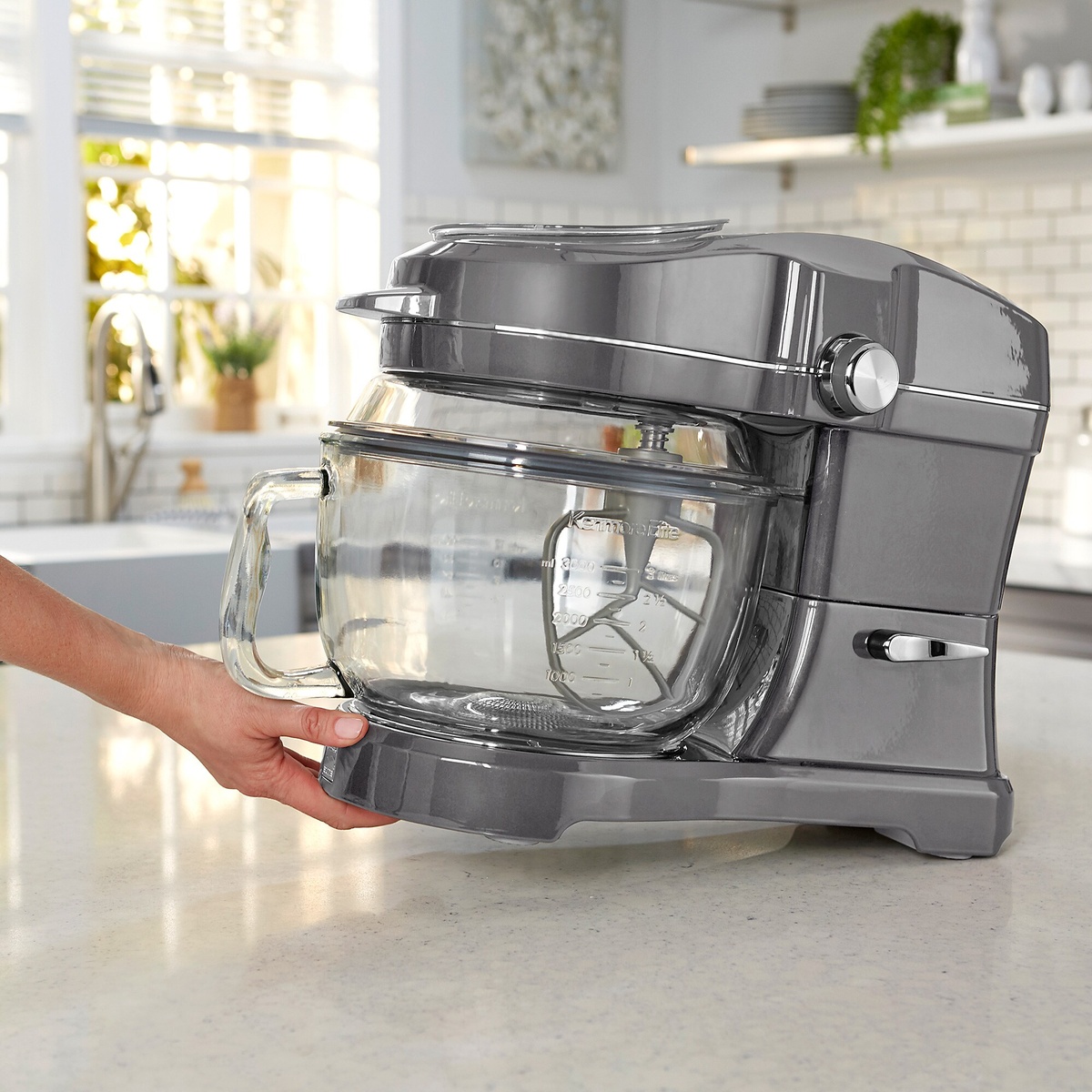 Kenmore Elite Ovation stand mixer on a kitchen counter with the glass bowl installed