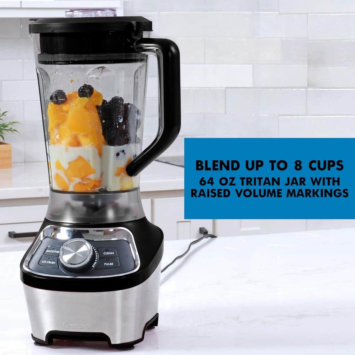 Kenmore blender on a countertop with fruit in the jar and text noting blend up to 8 cups with a 64 oz Tritan jar and volume markings