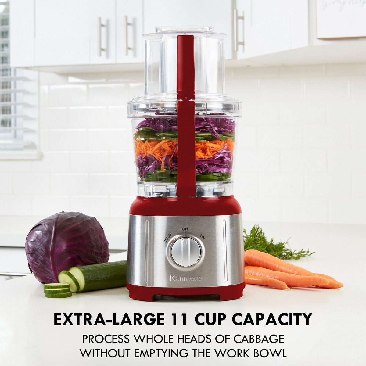 Kenmore red and stainless food processor on a kitchen counter with vegetables and text highlighting extra-large 11 cup capacity