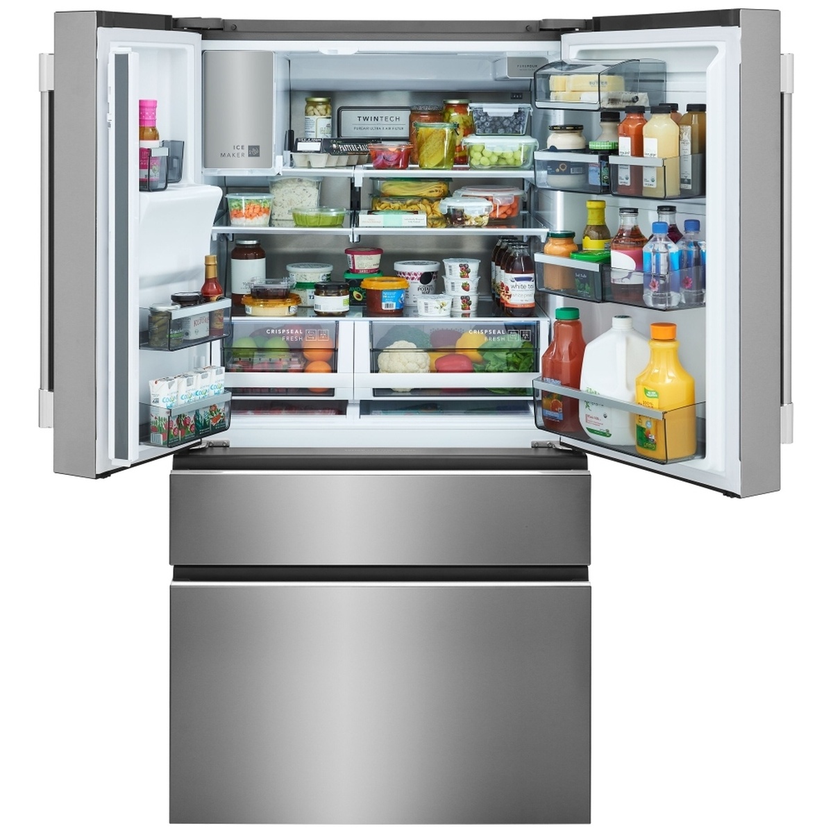 Refrigerator interior with adjustable glass shelves, door bins, LED lighting, ice maker in the fresh food section, and two crispers