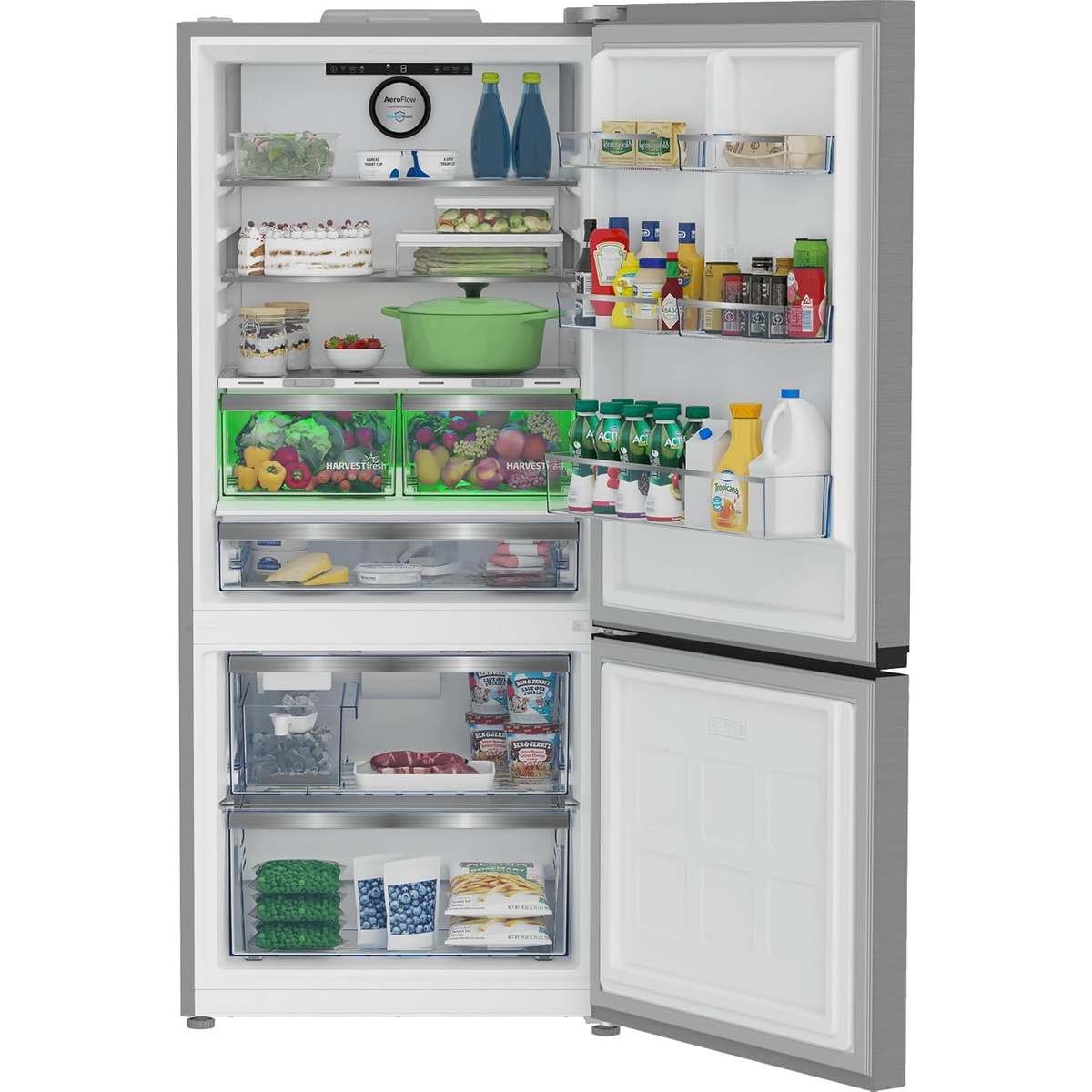 Interior view of Beko BFBF30116SSIM showing HarvestFresh crisper drawers lit in green, glass shelves loaded with food and beverages, door racks stocked with condiments and drinks, and an open bottom freezer compartment with two drawers