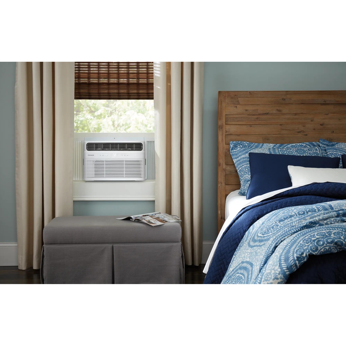 Frigidaire window-mounted air conditioner installed in a bedroom window