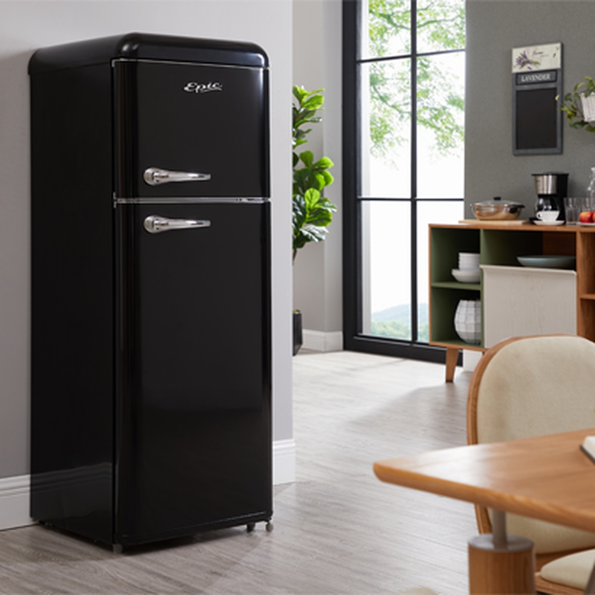 Epic ERR82BL-1 glossy black retro refrigerator with chrome handles styled in a modern kitchen dining area