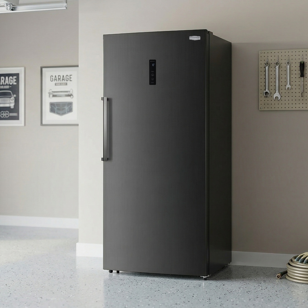 Marathon MFF212BLS black steel convertible fridge freezer installed in a residential garage alongside tools and equipment