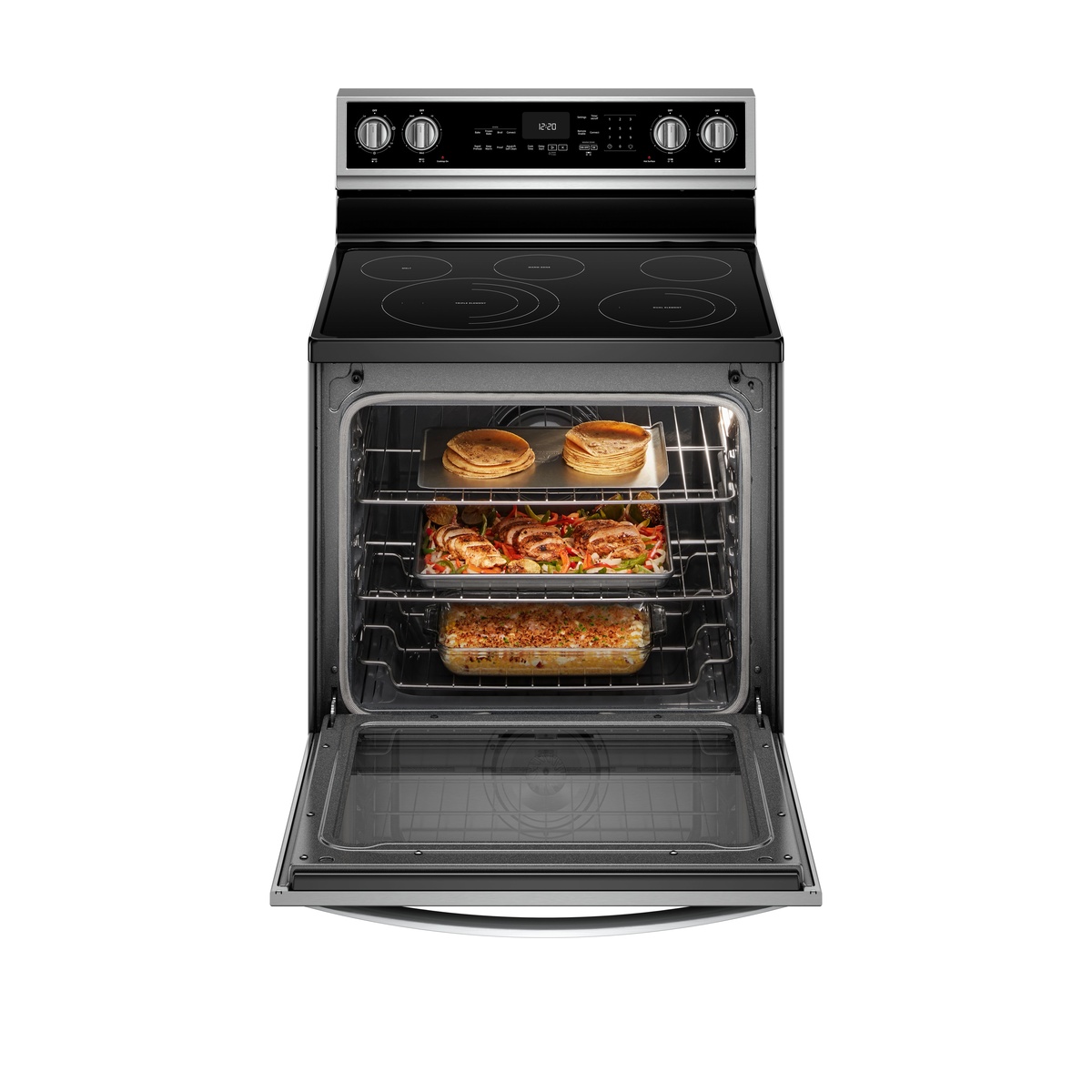 Whirlpool YWFE975H0HZ oven door open showing three racks loaded with food including flatbreads, a sheet pan with roasted chicken and vegetables, and a casserole dish