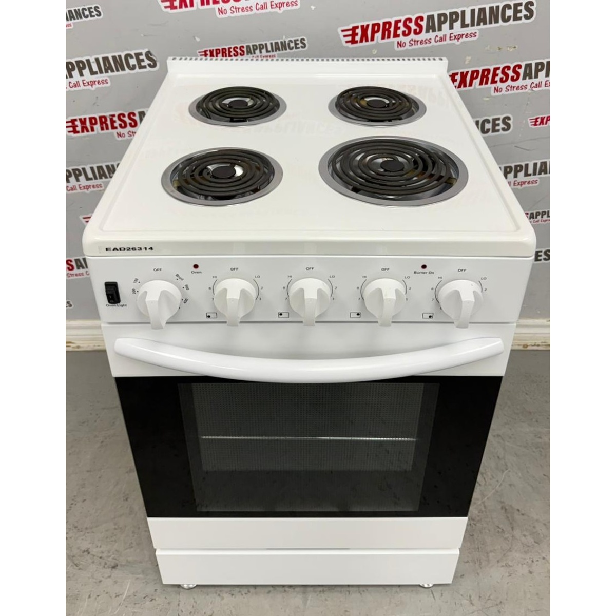 Top view of the white Elements electric range showing four coil burners and front control knobs