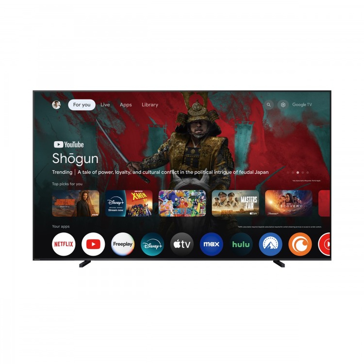 Front view of a large Hisense TV displaying the Google TV home screen with streaming app icons