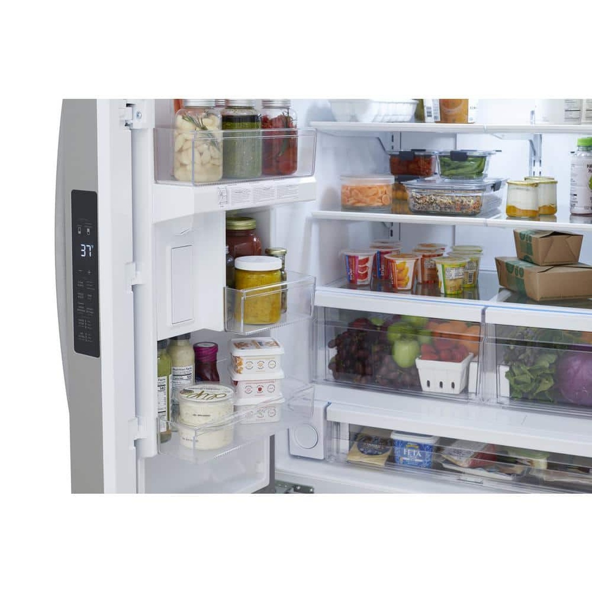 Inside view of the refrigerator showing door storage bins, shelves, crispers, and an interior digital temperature control panel