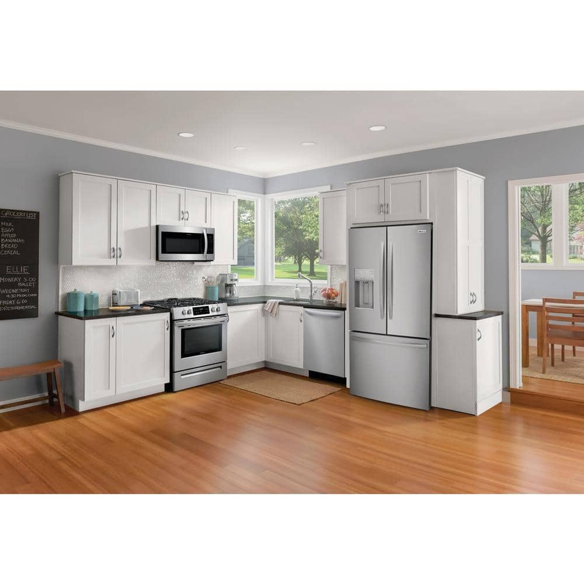 Stainless steel Frigidaire French door refrigerator installed in a bright kitchen