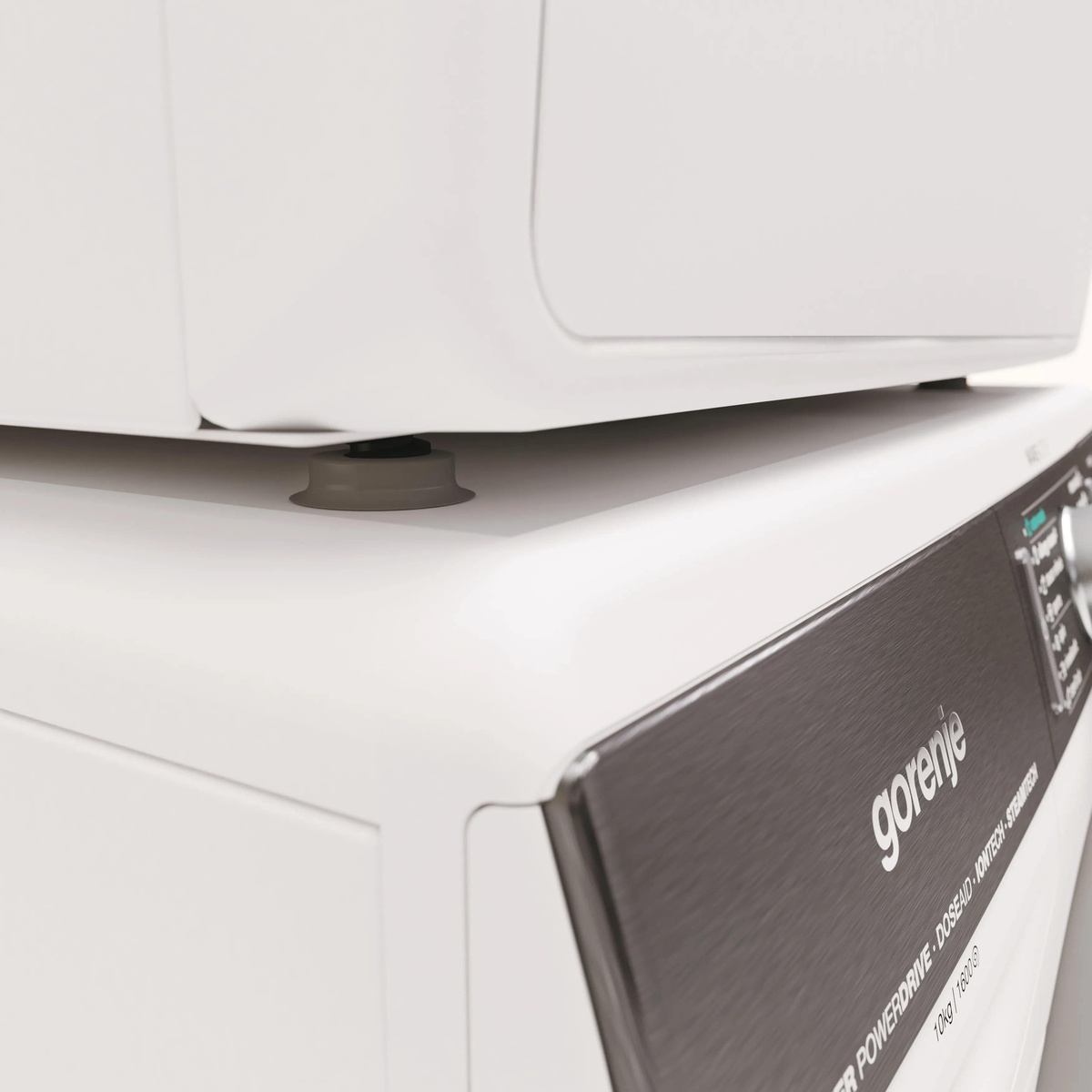 Close-up of a Gorenje logo badge on the front corner of an appliance