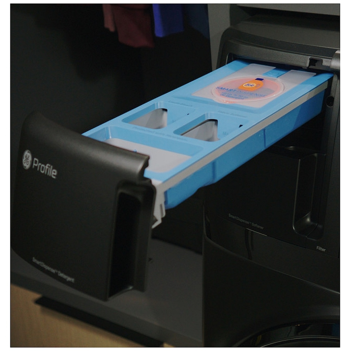 SmartDispense detergent and softener dispenser drawer pulled out on a GE Profile all-in-one washer dryer.