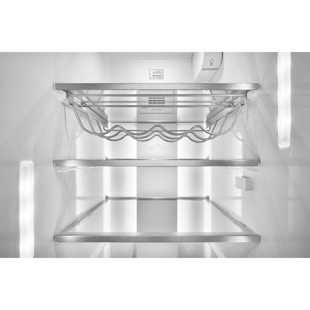Interior view of the refrigerator showing a built-in wine rack and metal-trimmed glass shelving