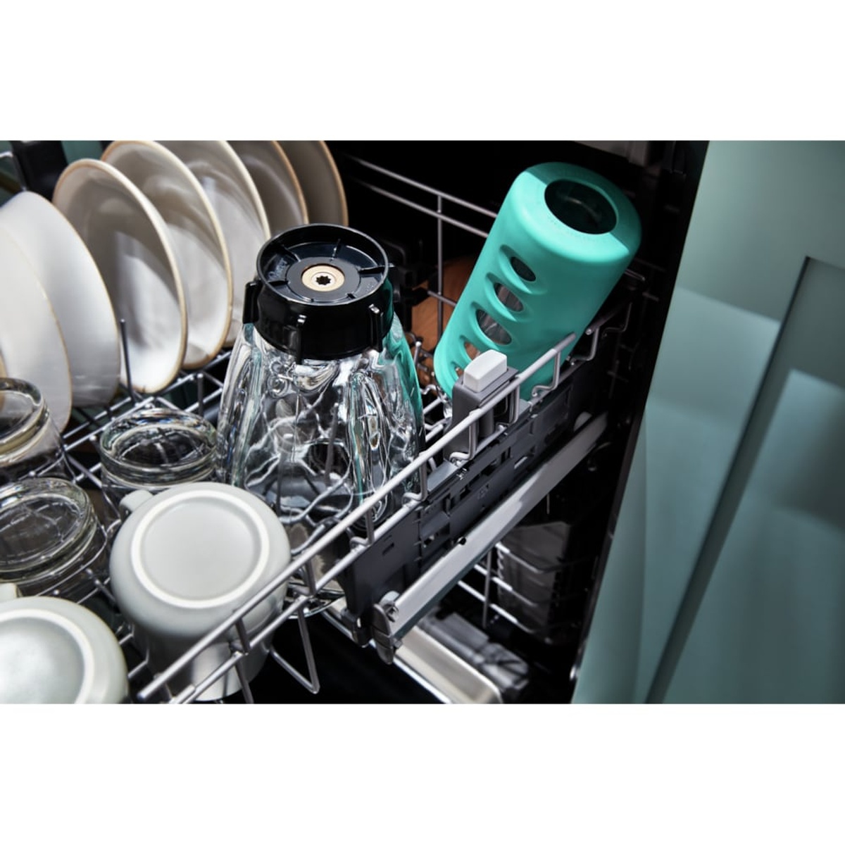 Close-up of the dishwasher upper rack loaded with glasses and tall items