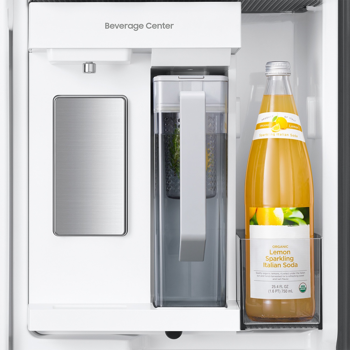 Close-up of the refrigerator's in-door Beverage Center showing the water dispenser area, a pitcher, and a bottled drink stored in the door bin