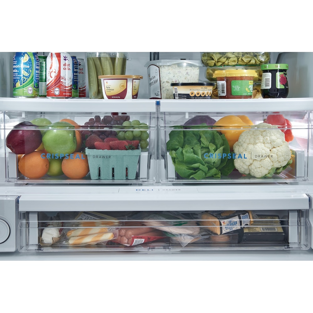 Close-up of the refrigerator interior showing two CrispSeal produce drawers and a full-width deli drawer below.