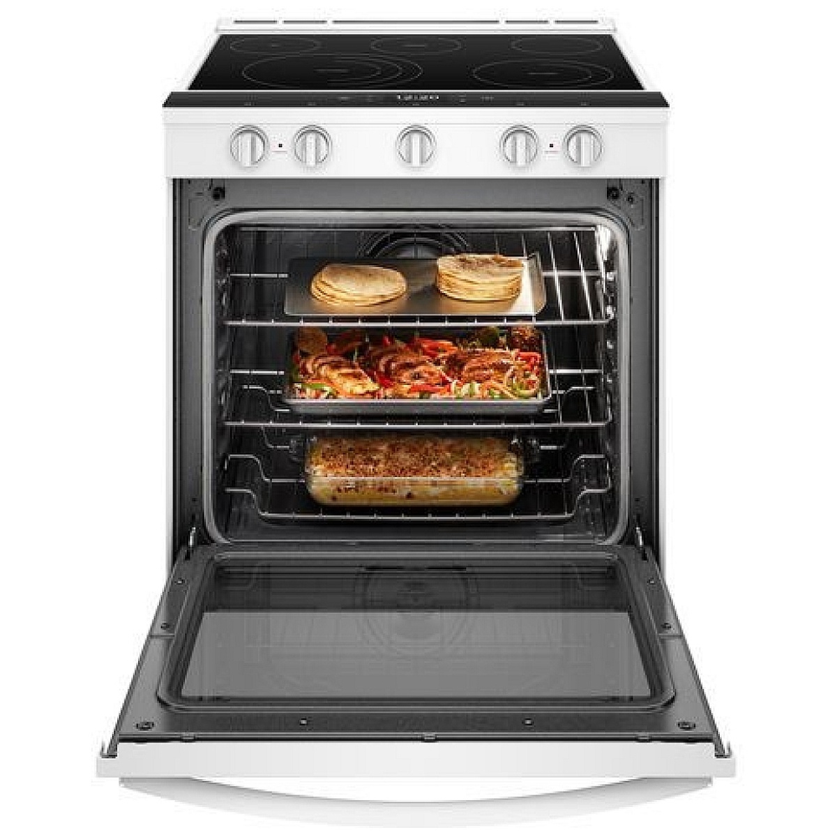 Oven door open showing multiple racks with food cooking
