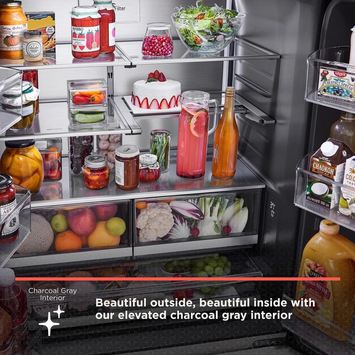 Close-up view of the refrigerator interior showing glass shelves, clear crisper drawers, and a charcoal gray interior